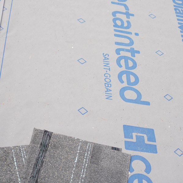 CertainTeed synthetic underlayment rolled over the roof deck with the first row of shingles going down