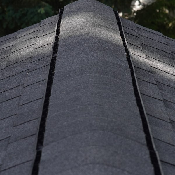 Shingle ridge cap with the ridge vent opening running along both sides of the peak